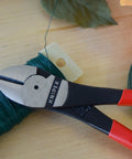Heavy Duty High Leverage Diagonal Cutters With Boss Level Power for Cutting Wire and Piano Wire on wooden surface