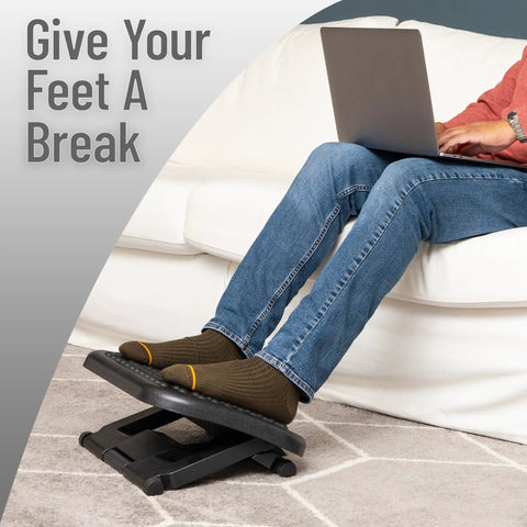 Person using Under Desk Foot Rest For Ergonomic Comfort, Height Adjustable From 3.25 To 6.25 Inches, Massage Textured Surface
