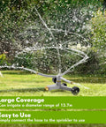 Heavy Duty Metal Rotary Lawn Sprinkler With 3 Arm Automatic Revolving Whirl And Wheeled Base Chainable in action on grass