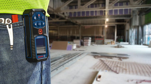 Person wearing Super Handy 165 Foot Blaze Laser Distance Measure With Backlit Color Display on belt at construction site