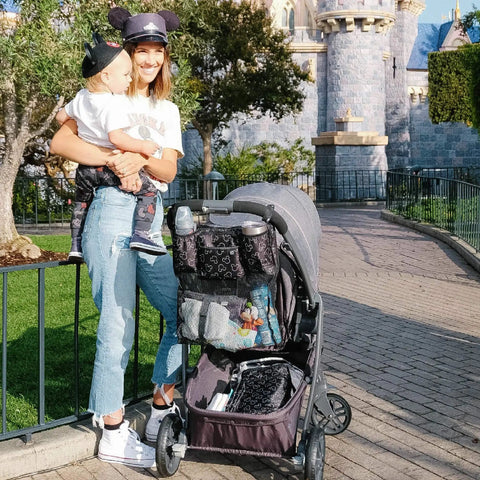 Mother with child and Cups N Cargo Stroller Caddy Organizer with Cup Holder outside theme park