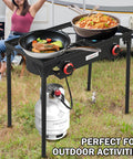 High Pressure Propane Outdoor Cooking Grill Burner For Camping And Backyard BBQs With CSA Regulator 0 To 20 PSIG And 4 Ft Gas Hose Dual Cast Iron Burners, showing dual burners cooking food, propane tank attached.