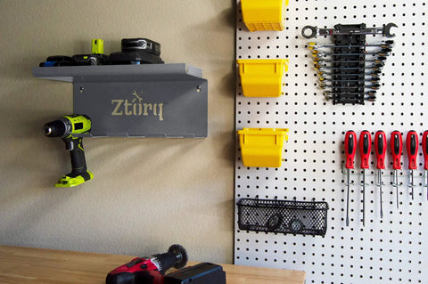 Cordless Drill Tool Organizer Wall Mount Charger and Storage Rack for Garage Organization, installed with tools on pegboard.