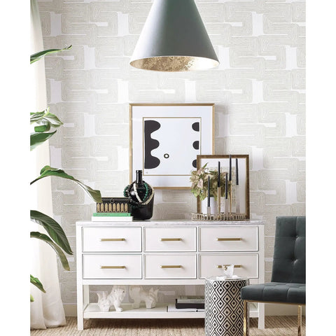 Room with Nikki Chu Zulu Signature Peel And Stick Vinyl Wallpaper Roll for easy no mess install, featuring white drawers and decor