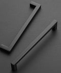 30 Pack 7.5 Inch Square Cabinet Handles Matte Black Drawer Pulls For Kitchen Cabinets And Cupboards placed on a dark surface