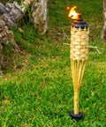 Heavy Duty Ground Stakes Torch Stand For Outdoor Tiki Torches on grass, showing freestanding spike base installation.