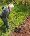Man using Heavy Duty Garden Shovel With 48 Inch Handle All Season Outdoor Tool for edging garden bed
