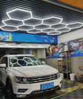 Hexagonal Led Garage Light Kit With 66 Lamps And Accessories Beast Bright Shop Light illuminating an auto detail shop