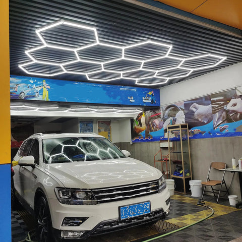 Hexagonal Led Garage Light Kit With 66 Lamps And Accessories Beast Bright Shop Light illuminating an auto detail shop
