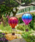 Set Of 2 Dope Hot Air Balloon Solar Lanterns For Outdoor Garden Decor in red and blue hanging from tree, 18 inch size