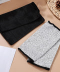Real Deal Cut Resistant Arm Sleeves For Mechanics And Gardeners With Snug Stretch Fit Anti Puncture Forearm Guards That Make The Daily Grind A Total Breeze In Black Gray, shown in black and gray colors.