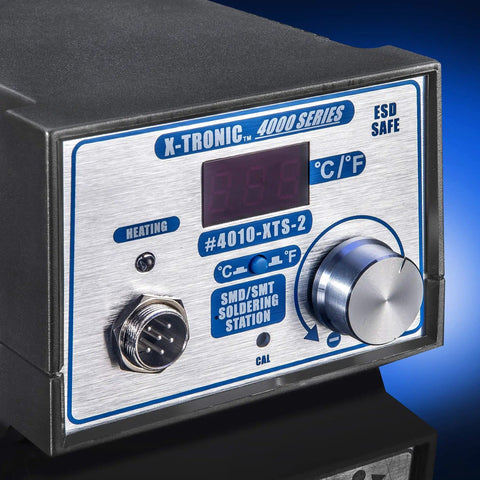 Close-up of 4010 XTS 2 Series 75 Watt Soldering Iron Station with digital display and control knob on a blue background.