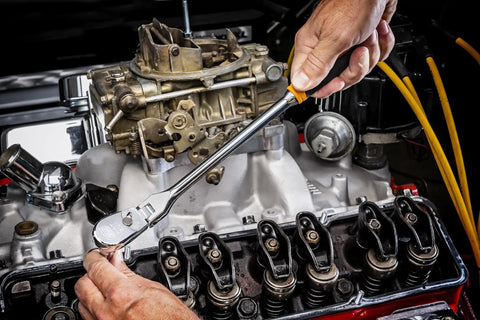 Mechanic using Three-Eighths Inch Drive 90-Tooth Cushion Grip Teardrop Ratchet with Low-Profile Head on engine bolts