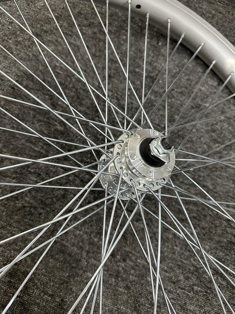Close-up of Beefy 26 Inch Bike Rim Wheel Set Built Tough With Double Wall Aluminum Alloy, showing hub and spokes, silver finish.