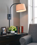 Oil Rubbed Bronze Sweep Wall Lamp With Adjustable Swing Arm And Swivel Shade, Sleek Modern Minimalist Vibe in reading nook setting