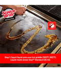 Scotch-Brit Quick Clean Griddle Cleaning System Starter Kit with liquid cleaner applied to hot griddle surface