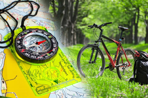 Orienteering Compass For Hiking And Camping, Pro-Grade Scout Tool For Map Reading on map near bicycle and backpack