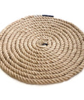 Natural Jute Rope 1.5 Inch Diameter 50 Feet Long Four Strand Heavy Duty For DIY Arts Crafts Garden Home Decor Hammock And Tug Of War Eco Friendly Plant Fiber coiled on a surface.