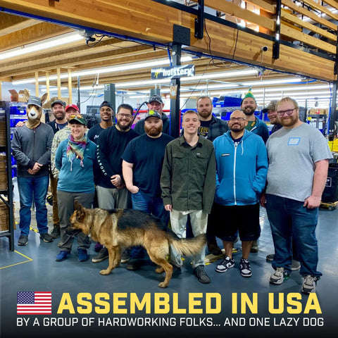 Group of workers with a dog in a workshop, captioned 'Assembled in USA'