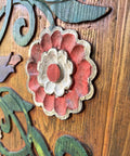 Close-up of Handcrafted Wooden Sliding Barn Door With Peacock And Floral Design For Rustic Farmhouse Cabin Decor, hand-painted flower