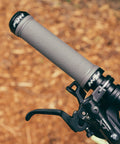 Mounted double lock on clamp mountain bike grips with diamond pattern for MTB and BMX 22 mm inner diameter, gray focus on handlebar