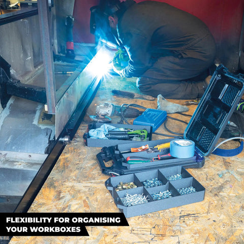 Worker using tools with a Four Compartment ABS Tool Tray For Milwaukee Packout Compatible Half Width Boxes in a van workshop.