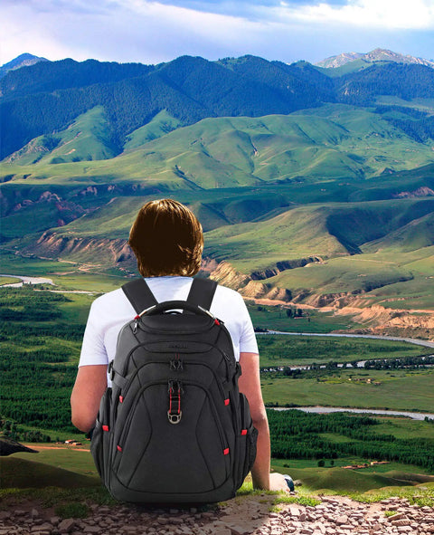 Person hiking with Go-To Travel Laptop Backpack 17.3 Inch XL With Hard Shell Saferoom And RFID Pockets, scenic mountain view