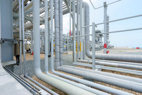 Industrial pipes in a facility, possibly using stainless steel materials, related to Stainless Steel Clip Style Buckle product use.