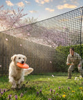 10x10 Ft Golf Practice Fence Net in backyard with a dog and person, 400GSM heavy duty barrier net for driving and chipping practice