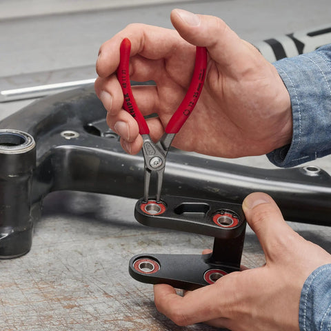 Internal Precision Snap Ring Pliers 5.50 Inch Pro Grade Tool For Precision Fits in use by mechanic fixing machinery part