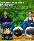 Two people enjoy Portable Propane Fire Pit 19 Inch Smokeless Gas Firebowl With Carry Kit And Cover, 58,000 BTU in backyard