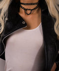 Dope Gothic Punk Leather Choker Necklace Featuring Adjustable Black Heart Chain worn on model's neck with black leather jacket.