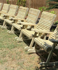 Row of unfinished wooden rocking chairs in a backyard, crafted using Dead Easy Outdoor Rocking Chair Plans With Smooth Ride Precision Mdf Templates And Goof Proof Step By Step Guide For Ultimate Backyard Kickback Lounge Made In Usa.