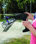 Child using ergonomic remote for Crosslander RC18 Electric Motocross Bike With 2.4 GHz Radio Control Up To 12 Kmph Speed on dirt track