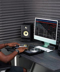 Acoustic Isolation Platform For 5 Inch Studio Monitors, Thick High Density Foam Riser, 9.5 By 7 By 1.8 Inches, Two Piece Speaker Pad Reducing Vibration For Crisp, Clear Sound In Home Studio under speakers on a desk in a home studio setup.