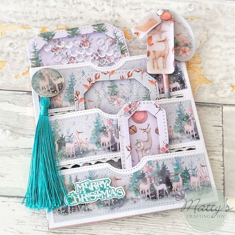 Stitched Slots Pocket Die Cut Set For Card Making And Scrapbooking displayed with Christmas-themed decor and tassel