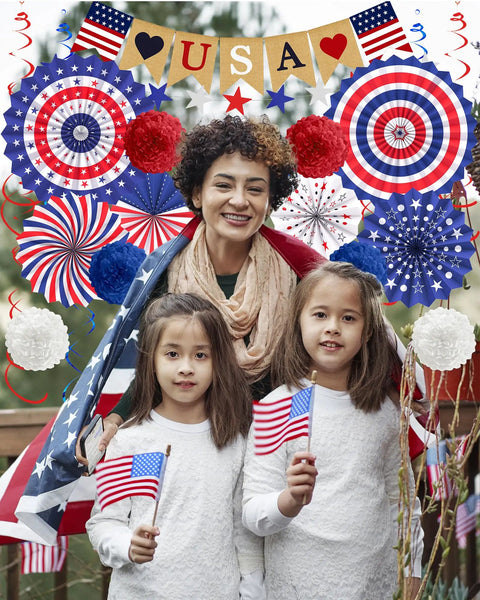 Patriotic Decorations Bundle for Veterans Day and Fourth of July with paper fans, poms, USA flags, Love USA banner, outdoors
