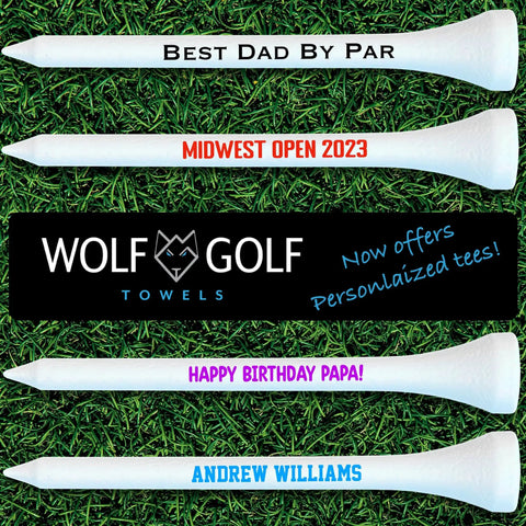 Personalized golf tees with custom font and color options displayed on grass.