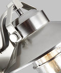 Close-up of Boynton Outdoor Wall Light With Transitional Stone Finish, featuring metal fixture detail and glass bulb cover.