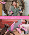 Real Deal Full Size Corded Hot Glue Gun Bundle With Stable Self Standing Base And 10 Heavy Duty Glue Sticks Made For Daily Crafts Or Weekend Warrior Diy Tasks Pink Grey 60W held by a user, bonding materials.