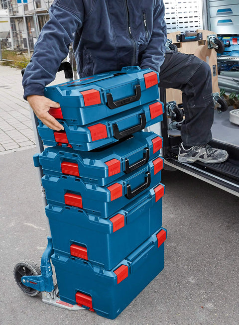 Person transporting stackable tool storage case with 1-click lock, top front and side handles for easy transport, built tough for trade pros and DIY, 4.5 in by 14 in by 17.5 in, blue