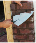 Philadelphia Style Brick Trowel With DuraSoft Handle For Brickwork Blockwork And Stonework, 11 X 5 And A Half Inch in use on brick wall
