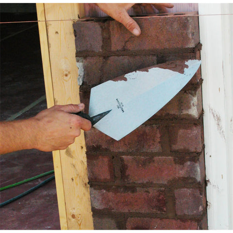 Philadelphia Style Brick Trowel With DuraSoft Handle For Brickwork Blockwork And Stonework, 11 X 5 And A Half Inch in use on brick wall