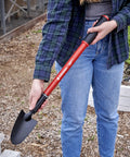 Person holding Extendable Garden Trowel With Adjustable Telescoping Handle For Raised Beds, 18 To 32 Inch Reach in garden