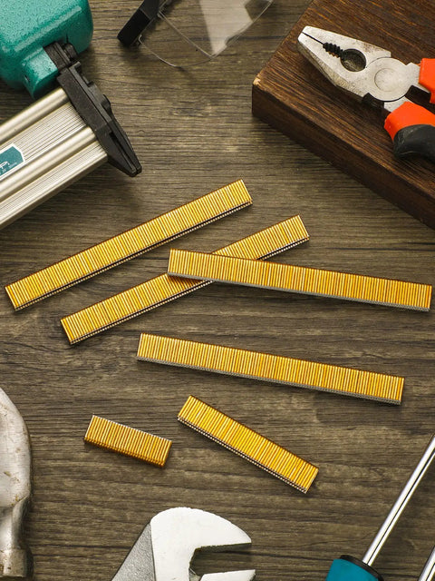 Pro Level 18 Gauge Narrow Crown Staples 7500 Count 1/2 X 1/4 Inch gold staples displayed with tools on wooden surface.