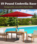 Heavy Duty 19 Pound Outdoor Umbrella Base Stand For Patio Tables And Tilt Freestanding Umbrellas, visible by poolside with red umbrella