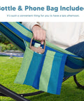 Person sitting in a hammock with a built-in bottle and phone bag. Heavy Duty Hammock Stand With Foldable Frame For Patio Hangout.