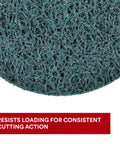 Close-up of XT Pro Extra Cut Disc surface with green aluminum oxide abrasive for heavy duty metal stripping and surface prep.