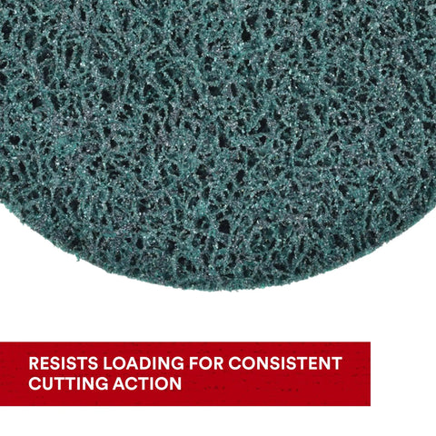 Close-up of XT Pro Extra Cut Disc surface with green aluminum oxide abrasive for heavy duty metal stripping and surface prep.