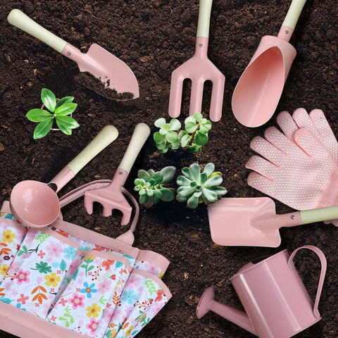 Kids Garden Gear 14-Piece Tool Kit With Tote Bag featuring tools, floral tote, gloves, and watering can on soil with plants